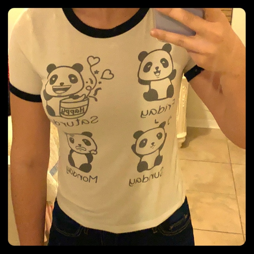 This is a juniors crop-top with a panda on it.